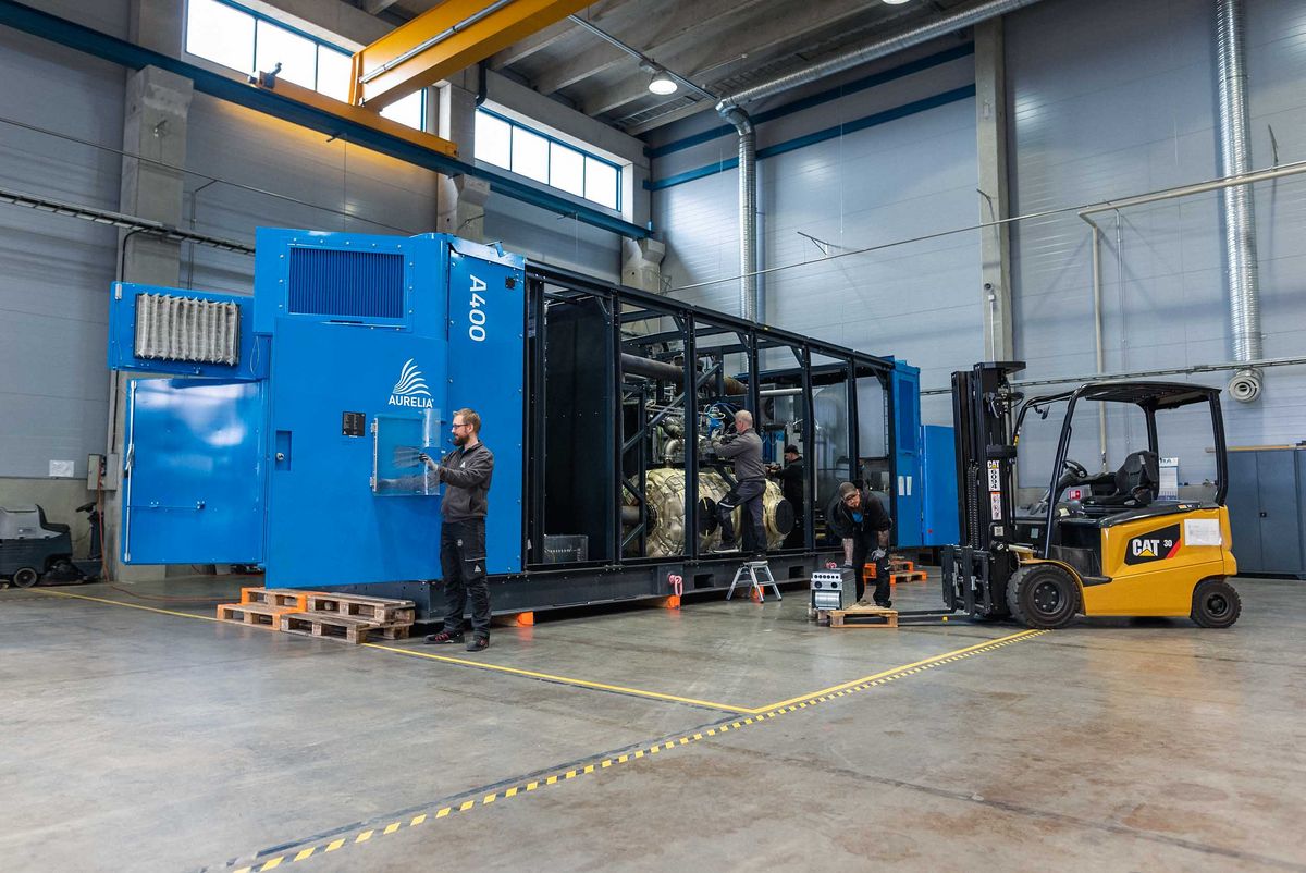 Aurelia turbines blue container in the industrial hall.